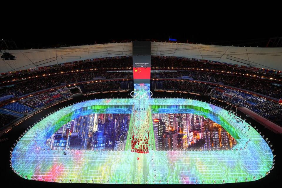 Athletes from China arrive during the opening ceremony of the 2022 Winter Olympics, Friday, Feb. 4, 2022, in Beijing. (AP Photo/Jeff Roberson)