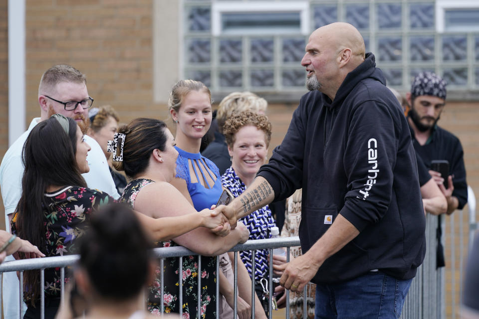 Democratic Pa. Lt. Gov. John Fetterman greets people at a United Steelworkers of America Local Union 2227 event in West Mifflin, Pa., Monday, Sept. 5, 2022, that President Joe Biden also attended. (AP Photo/Susan Walsh)