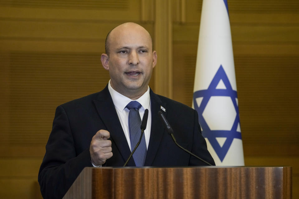 Israeli Prime Minister Naftali Bennett delivers a statement at the Knesset, Israel's parliament, in Jerusalem, Wednesday, June 29, 2022. Bennett will not run in upcoming elections, after he led a broad but fragile coalition government that came unraveled barely a year after taking office. (AP Photo/Tsafrir Abayov)