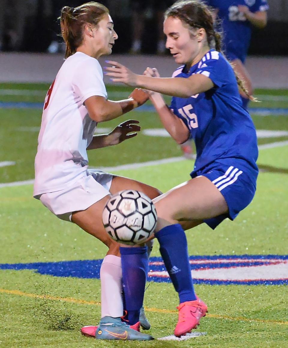 Girard senior Madison Soudan, left, and Seneca senior Aubrey Hammill compete during a PIAA District 10 Class A girls soccer semifinal at Fort LeBoeuf High School in Waterford on Thursday.