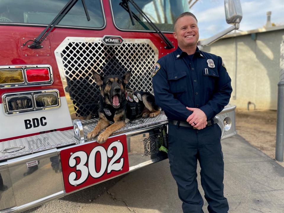 San Bernardino County Fire Captain Brent Cannon and Support K9 Remi at the ribbon cutting ceremony for the Timberlane Dog Park in Hesperia on Friday, Jan. 19, 2024.