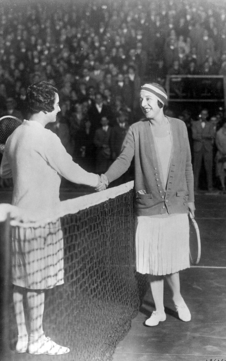 Mary K Browne (L) congratulates Suzanne Lenglen on her win in 1926