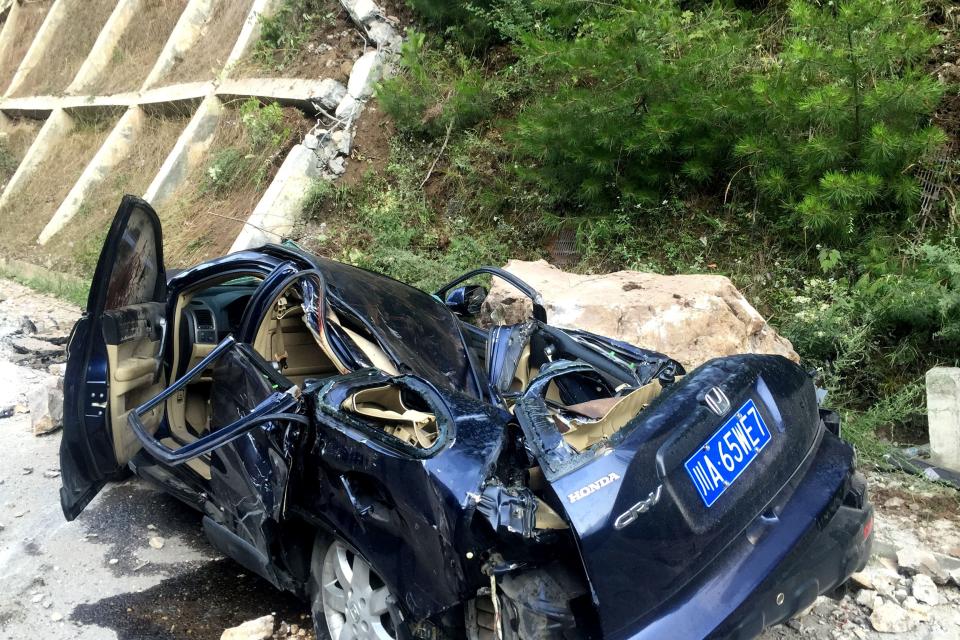 <p>A car damaged during an earthquake is seen in Jiuzhaigou in China’s southwestern Sichuan province on Aug. 9, 2017. (Photo: STR/AFP/Getty Images) </p>