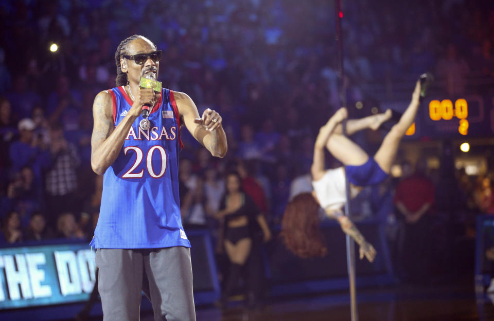 In this Friday, Oct. 4, 2019 photo, rapper Snoop Dogg performs during Late Night in the Phog, Kansas' annual NCAA college basketball kickoff, at Allen Fieldhouse in Lawrence, Kan. (Nick Krug/The Lawrence Journal-World via AP)