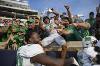 Marshall players and fans celebrate after defeating Notre Dame 26-21 in an NCAA college football game Saturday, Sept. 10, 2022, in South Bend, Ind. Marshall won 26-21. (Sholten Singer/The Herald-Dispatch via AP)