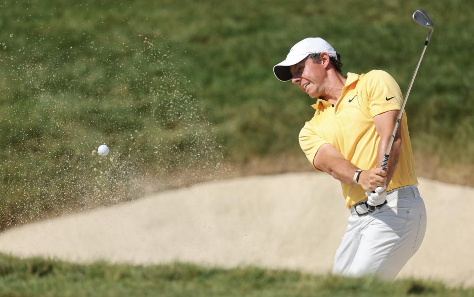 Rory McIlroy plays a shot from a bunker on the 14th hole during the final round of the Memorial Tournament - Michael Reaves/Getty Images