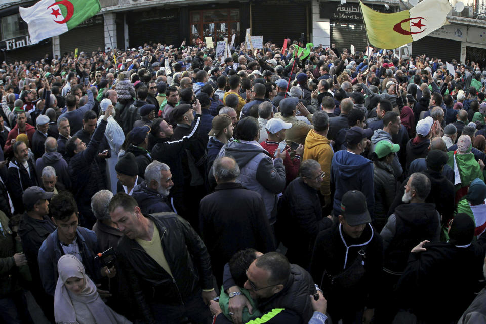 People take to the streets in the capital Algiers to protest against the government, for the 50th Friday running, in Algeria, Friday, Jan. 31, 2020. (AP Photo/Fateh Guidoum)