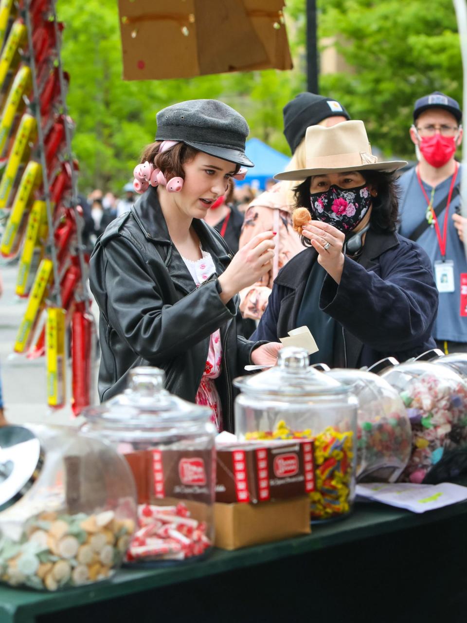 <p>In between takes, Brosnahan chatted with the show's creator, Amy Sherman-Palladino, near a candy cart.</p>