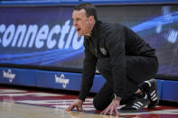 Rhode Island head coach Archie Miller yells to his team from the sideline during the first half of an NCAA college basketball game against Dayton, Saturday, Jan. 20, 2024, in Dayton, Ohio. (AP Photo/Aaron Doster)