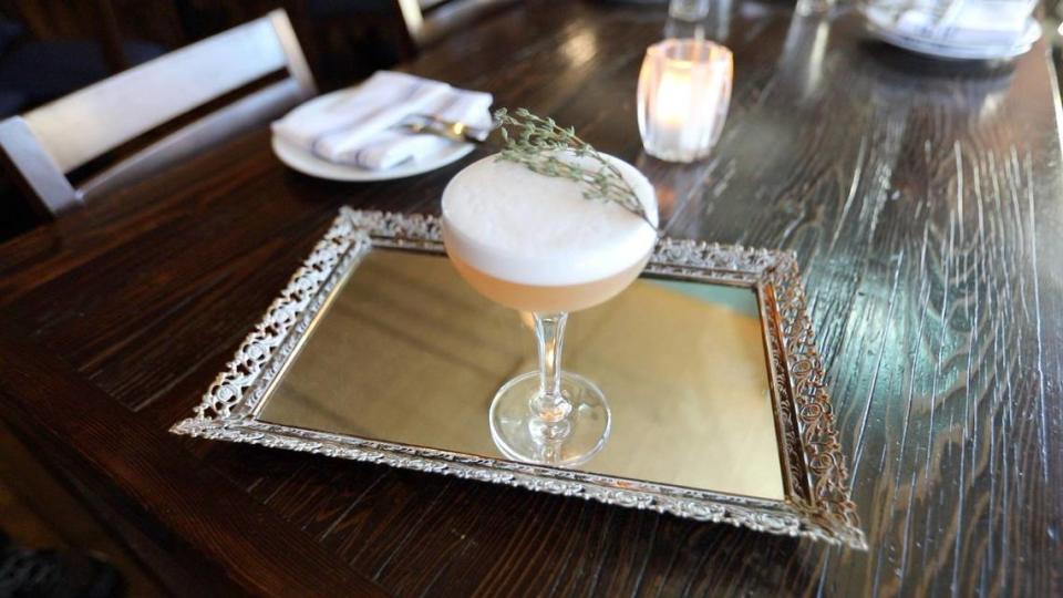 This La Cosecha specialty drink named “You Know Who I Am?” is made with Haku vodka, cranberry, cardamom, lemon and orgeat, infused with with egg white and a sprig of thyme. Laura Dickinson/ldickinson@thetribunenews.com