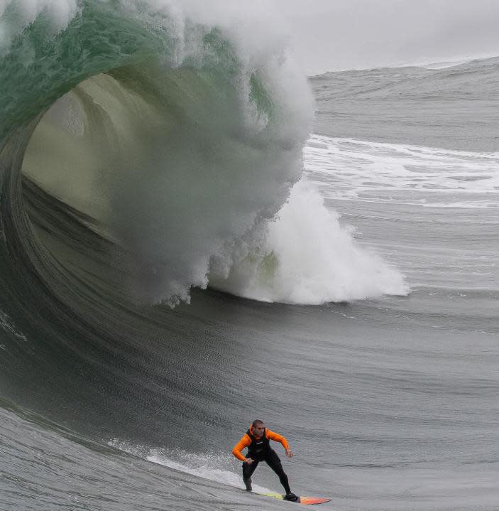 A brave surfer catches a barreling bomb on Dec. 28, 2023 off the coast of Half Moon Bay, Calif. (Photo by Frank Quirarte Photography)
