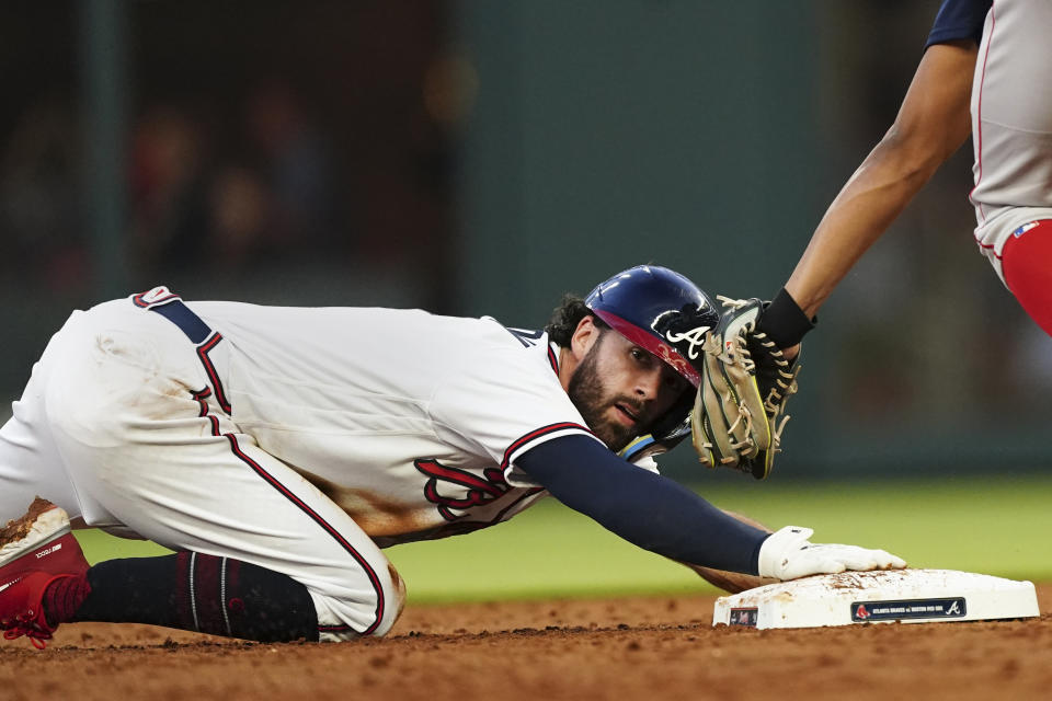 Atlanta Braves' Dansby Swanson (7) steals second base in the third inning of a baseball game against the Boston Red Sox Wednesday, May 11, 2022, in Atlanta. (AP Photo/John Bazemore)