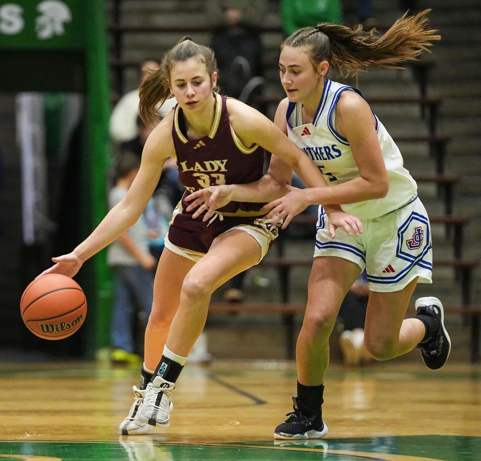 Columbia City Eagles Addison Baxter (33) rushes up the court against Jennings County Panthers Madelyn McIntosh (5) on Thursday, Oct. 5, 2023, during the Hall of Fame Classic girls basketball tournament at New Castle Fieldhouse in New Castle. The Columbia City Eagles defeated the Jennings County Panthers, 56-47.