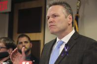 FILE - In this March 12, 2020 file photon Alaska Gov. Mike Dunleavy speaks during a news conference in Anchorage, Alaska. Dunleavy has announced that checks from the state's oil-wealth fund will begin going out to residents three months early, citing economic hardships related to the coronavirus. (AP Photo/Mark Thiessen,File)