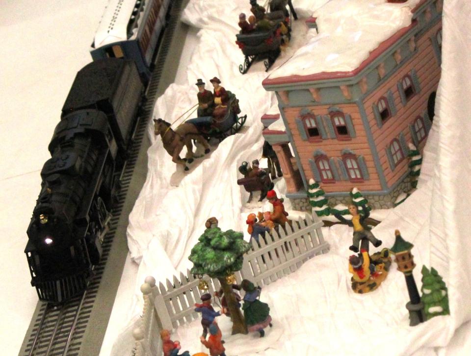 A miniature Christmas village and operating toy train are just some of the holiday decorations on display at the Monroe County Museum.