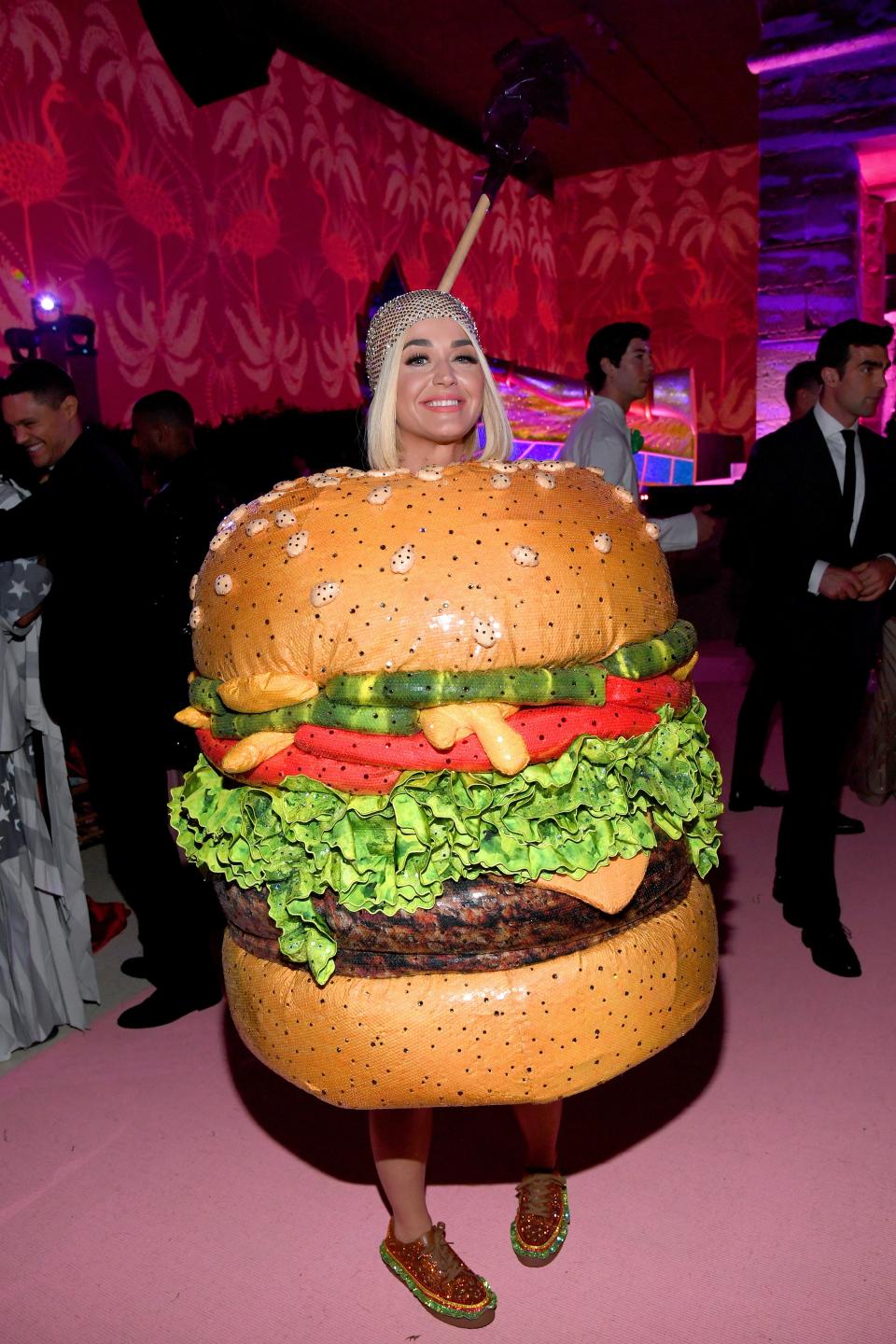 And to finish off the campy night, Katy slipped out of her chandelier ensemble and into this hamburger — sorry, cheeseburger — costume. For better or worse, it was the talk of the town.