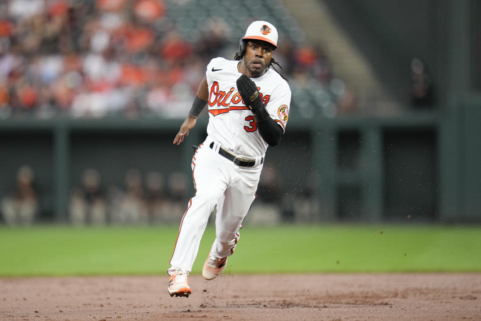 Baltimore Orioles' Cedric Mullins runs from first base to third on a single by Aaron Hicks against the St. Louis Cardinals in the second inning of a baseball game, Monday, Sept. 11, 2023 in Baltimore. Mullins scored on the play on a throwing error by Cardinals third baseman Nolan Arenado. (AP Photo/Julio Cortez)