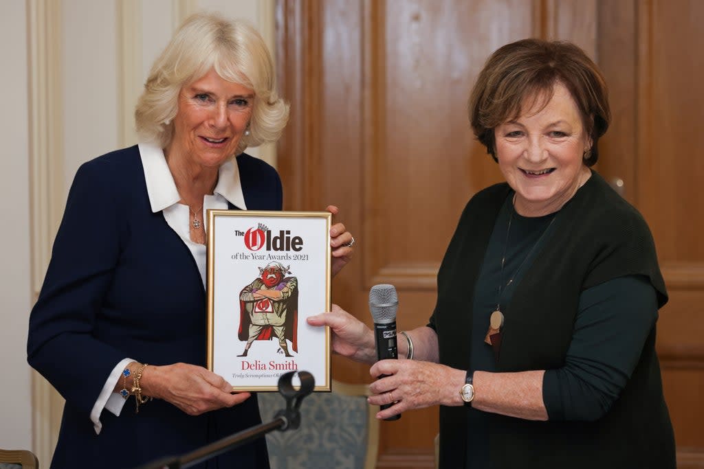 Camilla, Duchess of Cornwall, presents Dame Delia Smith with the Truly Scrumptious Oldie of the Year award.  (REUTERS)