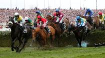 Horse Racing - Crabbie's Grand National Festival - Aintree Racecourse - 9/4/16 Rule The World ridden by David Mullins (C) before winning the 5.15 Crabbie's Grand National Chase Reuters / Andrew Yates Livepic