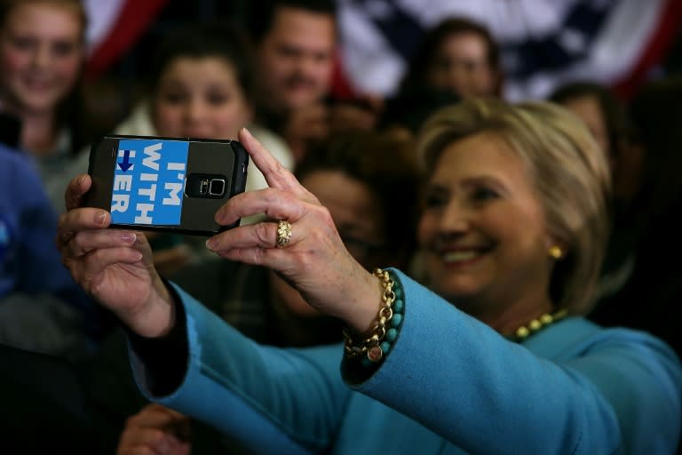 Democratic presidential hopeful Hillary Clinton takes a selfie with a supporter