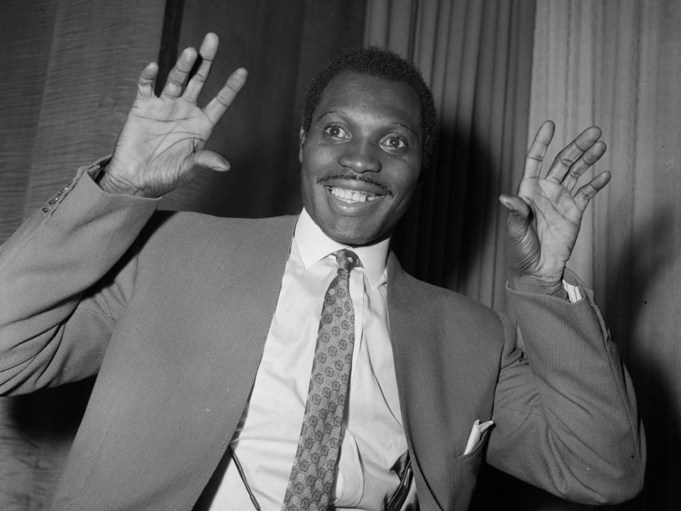 Calypso singer Aldwyn Roberts, known as 'Lord Kitchener', at the Savoy Hotel, 1957: Getty Images