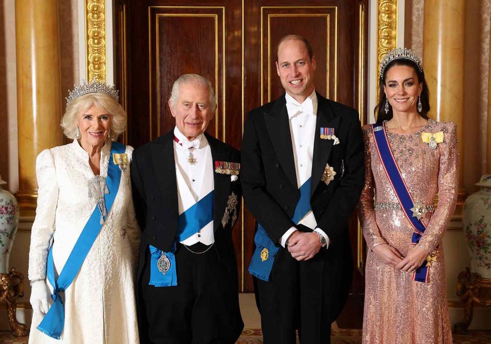 <p>Chris Jackson/Getty </p> From left: Queen Camilla, King Charles, Prince William and Kate Middleton on Dec. 5, 2023