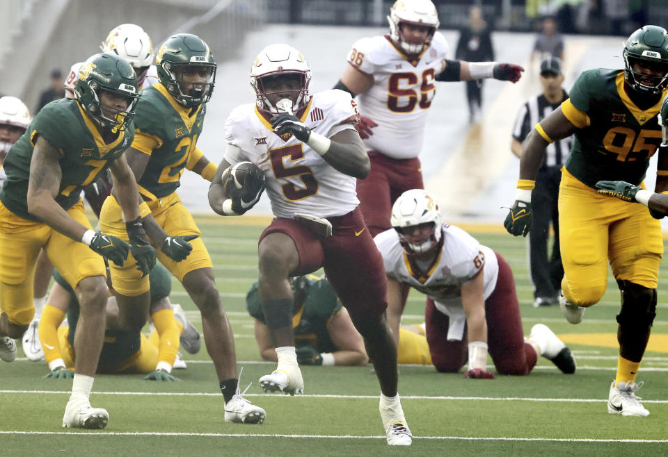 Iowa State running back Cartevious Norton scores past Baylor safety Bryson Jackson, left, and the rest of the defense in the second half of an NCAA college football game, Saturday, Oct. 28, 2023, in Waco, Texas. (Rod Aydelotte/Waco Tribune-Herald via AP)