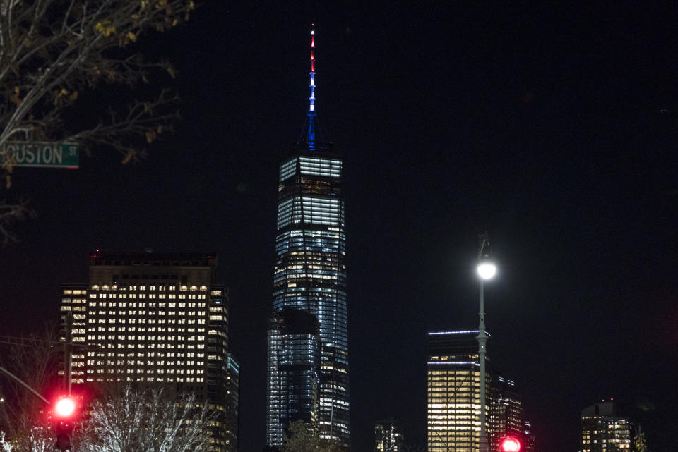 <em>As ordered by New York Governor Andrew Cuomo, the spire of One World Trade Centre is illuminated in red, white and blue (AP)</em>