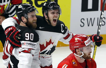 Ice Hockey - 2018 IIHF World Championships - Quarterfinals - Russia v Canada - Royal Arena - Copenhagen, Denmark - May 17, 2018 - Ryan O’Reilly of Canada celebrates with Connor McDavid after scoring a goal and winning a match. REUTERS/Grigory Dukor