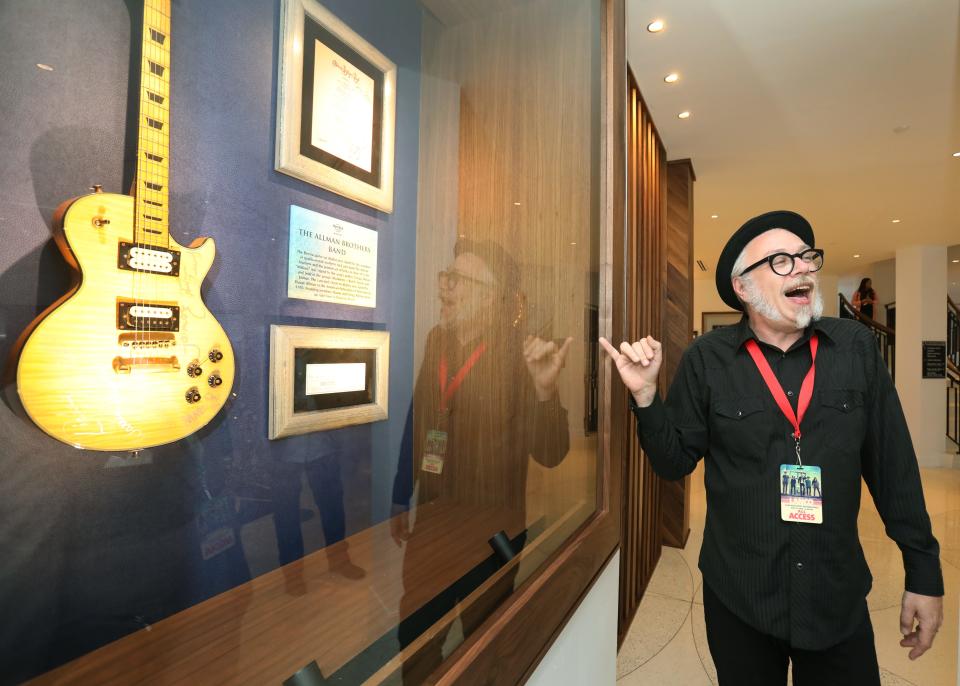 Hard Rock historian Jeff Nolan gives a tour of displays at Hard Rock Hotel's grand opening in May 2018 Daytona Beach.