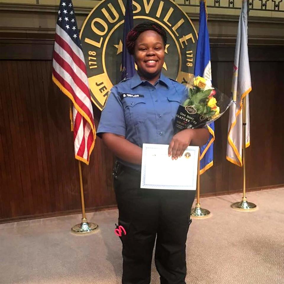 Breonna Taylor posing during a graduation ceremony in Louisville Kentucky. She was shot dead by police in her home in March - Family handout