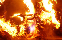 <p>An artist performs during the opening ceremony. REUTERS/Kai Pfaffenbach </p>