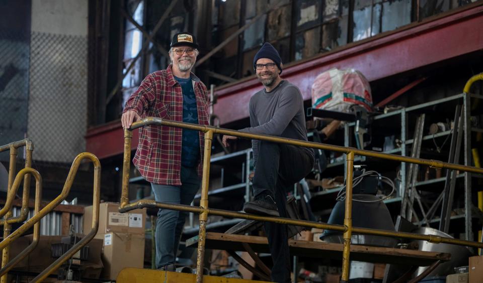 Erik Nordin, left, and Israel Nordin stand inside the Detroit Design Center in Detroit on Tuesday, April 11, 2023. Brothers Erik and Israel use torches and other metal-working tools in their 14,000-square-foot studio to create large art pieces for parks and public places in Michigan.