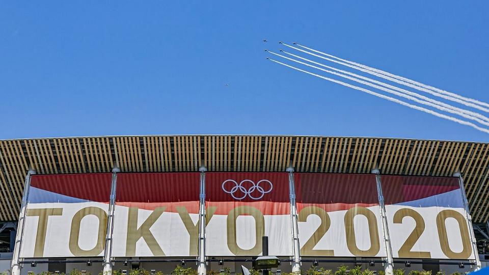 <div class="paragraphs"><p>Jet fly over Japan's National Stadium to mark the start of the 2020 Tokyo Olympics </p></div>