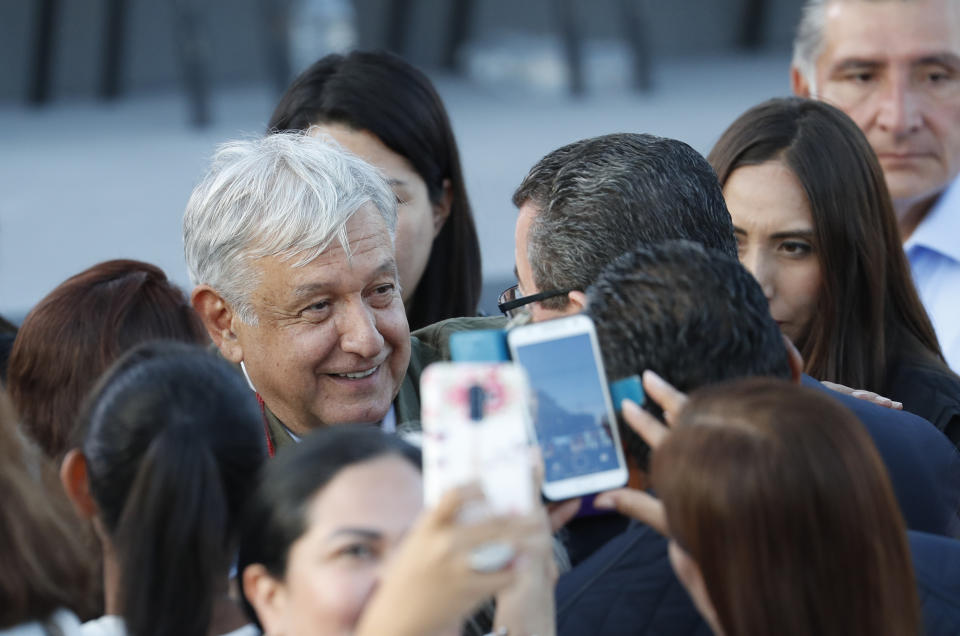 Mexican President Andres Manuel Lopez Obrador is greeted by well wishers after his speech at a rally in Tijuana, Mexico, Saturday, June 8, 2019. The event was originally scheduled as an act of solidarity in the face of President Donald Trump's threat to impose a 5% tariff on Mexican imports if it did not stem the flow of Central American migrants heading toward the U.S. But Mexican and U.S. officials reached an accord Friday that calls on Mexico to crackdown on migrants in exchange for Trump backing off his threat. (AP Photo/Eduardo Verdugo)