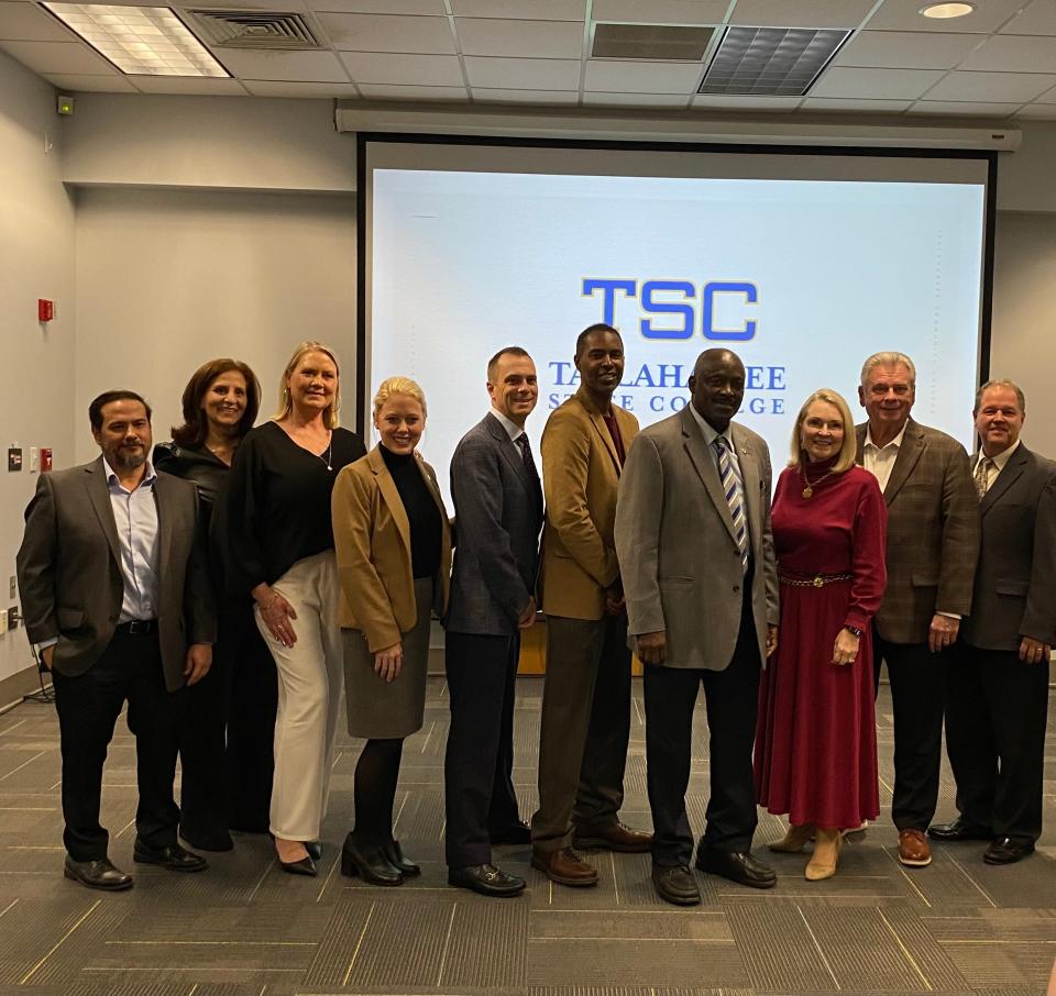 Pace President Diana Riser (third from left) takes a photo with Pace team members, TCC officials and TCC Board of Trustees members after a meeting on Tuesday, November 14, 2023.