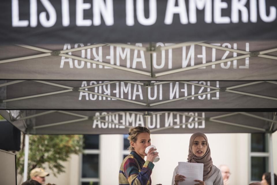 Alanna Vagianos and Rowaida Abdelaziz wait for people to come&nbsp;and tell their stories.