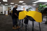 Michael Gonzales, 35, votes at the Uber Hub polling station