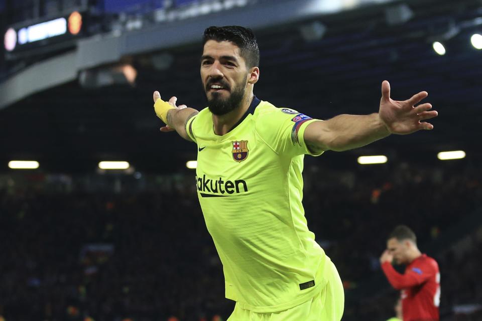 Barcelona's Luis Suarez celebrates after scoring the opening goal of his team during the Champions League quarterfinal, first leg, soccer match between Manchester United and FC Barcelona at Old Trafford stadium in Manchester, England, Wednesday, April 10, 2019. (AP Photo/Jon Super)