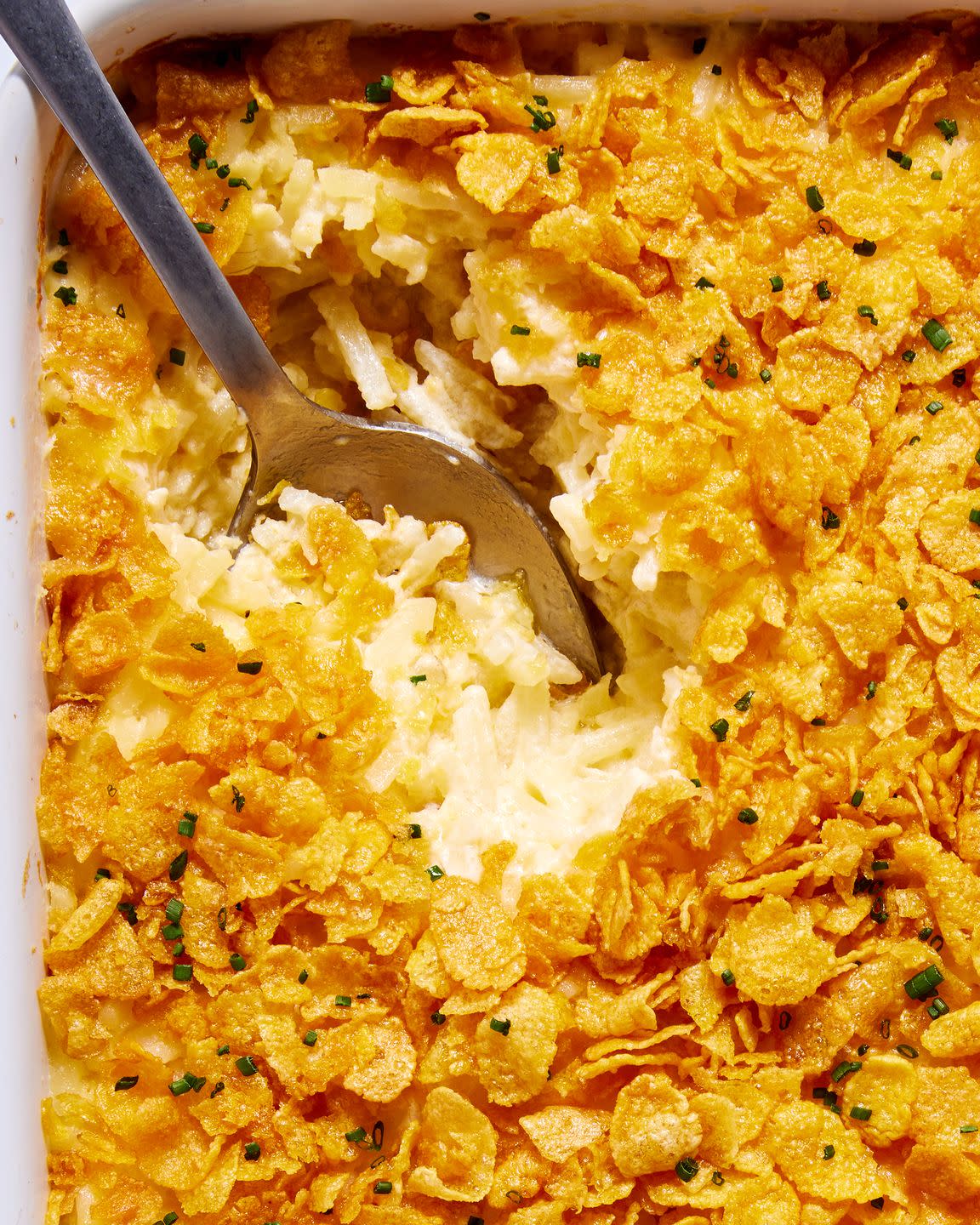 creamy cheesy potatoes with a buttery cornflake topping