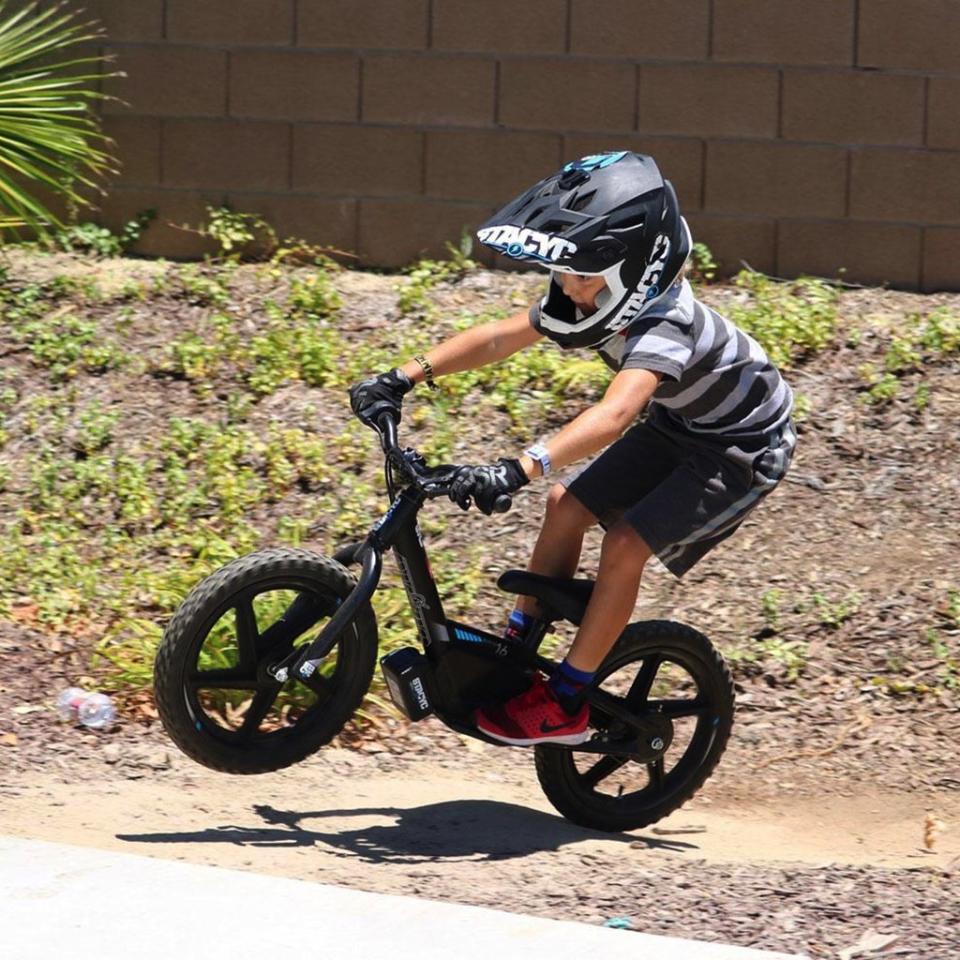 Child riding StaCyc electric bike