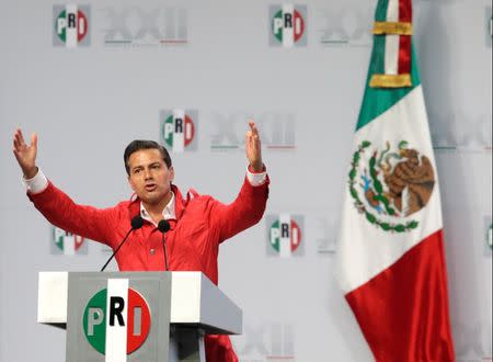 Mexican President Enrique Pena Nieto delivers his speech to supporters of the Institutional Revolutionary Party (PRI) during their national assembly ahead of the 2018 election at Mexico City’s Palacio de los Deportes, Mexico August 12, 2017. REUTERS/Henry Romero