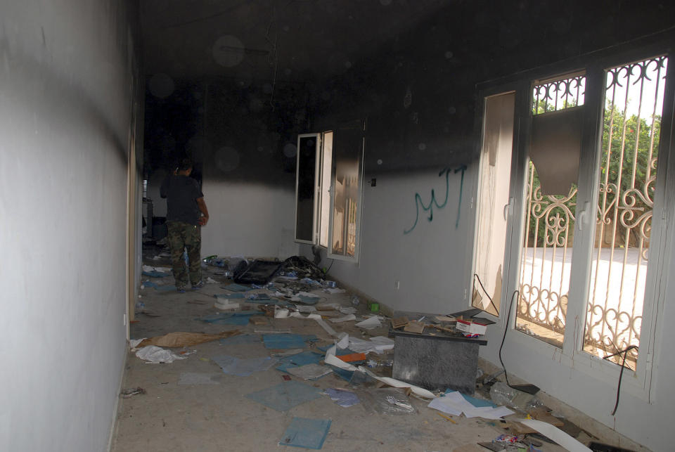 A man walks through a room in the gutted U.S. consulate in Benghazi, Libya, after an attack that killed four Americans, including Ambassador Chris Stevens, Wednesday, Sept. 12, 2012. (AP Photo/Ibrahim Alaguri)