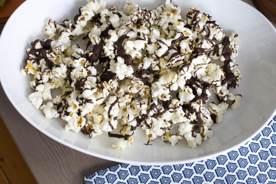 In this image taken on Jan. 28, 2013, Stovetop Popcorn Many Ways with melted chocolate is shown in Concord, N.H. (AP Photo/Matthew Mead)