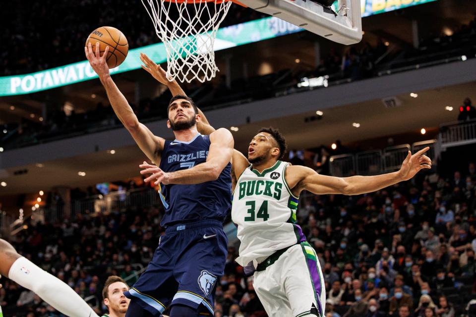 Jan 19, 2022; Milwaukee, Wisconsin, USA; Memphis Grizzlies forward Santi Aldama (7) shoots against Milwaukee Bucks forward Giannis Antetokounmpo (34) during the second quarter at Fiserv Forum. Mandatory Credit: Jeff Hanisch-USA TODAY Sports