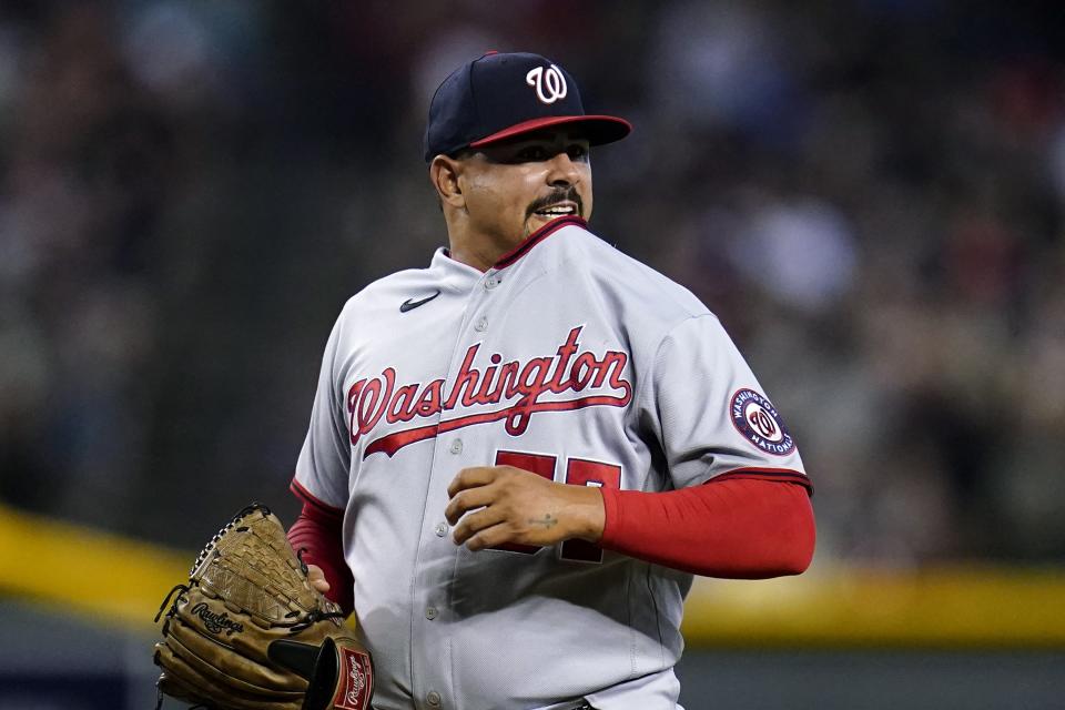 Washington Nationals relief pitcher Andres Machado reacts to giving up a two-run double to Arizona Diamondbacks' Alek Thomas during the sixth inning of a baseball game Saturday, July 23, 2022, in Phoenix. (AP Photo/Ross D. Franklin)