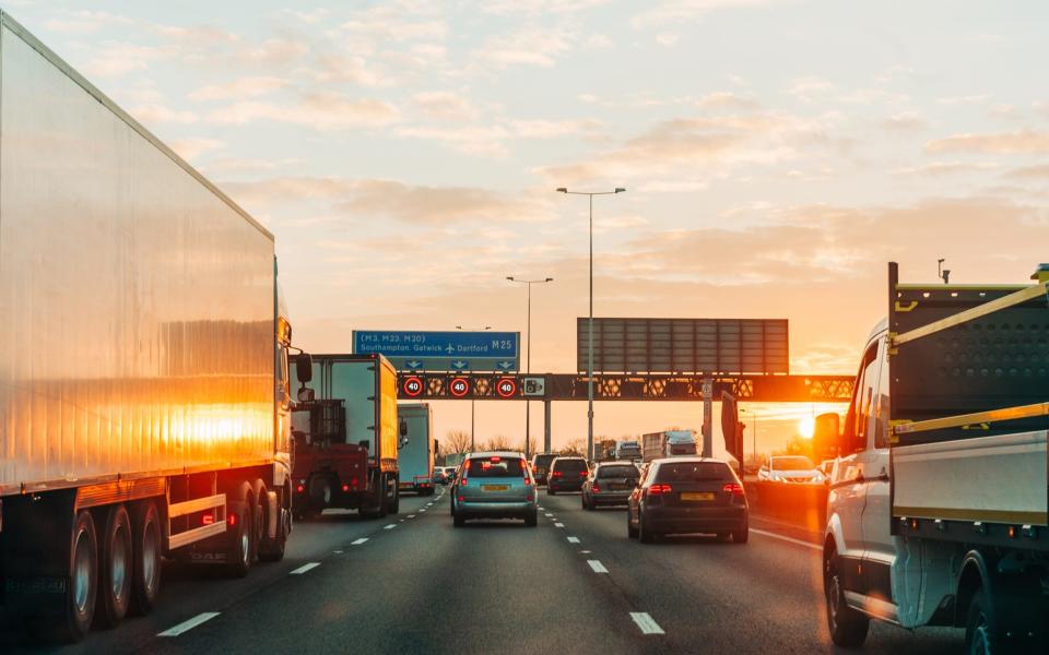 Sun setting on a motorway