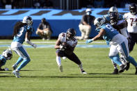 Chicago Bears running back David Montgomery (32) finds some running room against the Carolina Panthers during the second half of an NFL football game in Charlotte, N.C., Sunday, Oct. 18, 2020. (AP Photo/Mike McCarn)