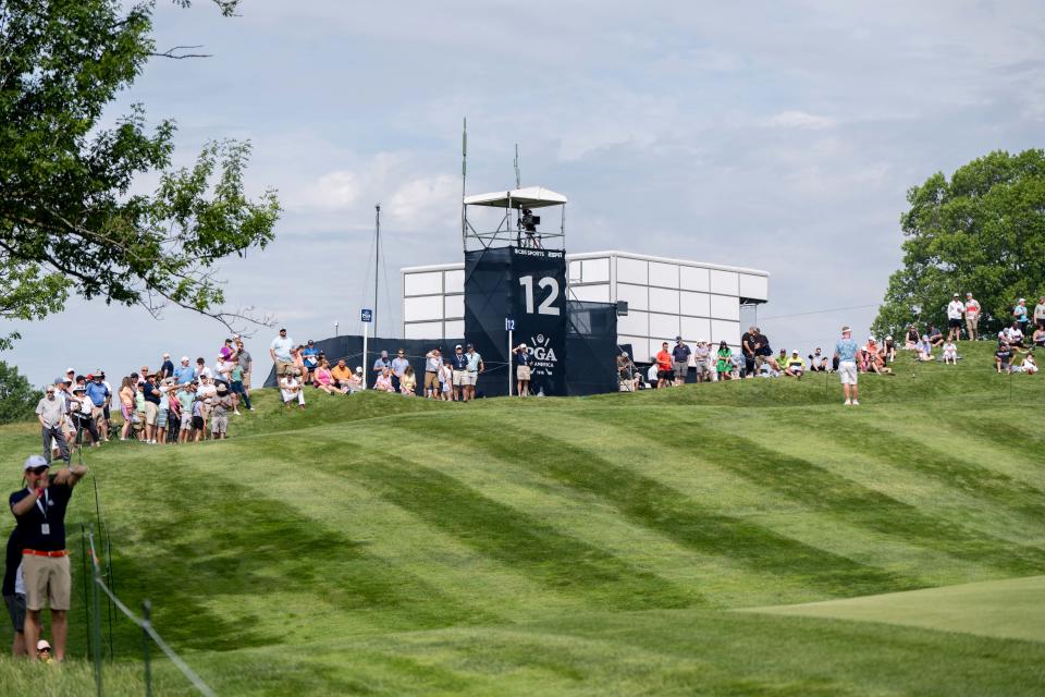 Fans watch Jared Jones and Tyler Collet practice on the 12th hole during the first day of practice for the PGA Championship on Monday, May 13, 2024 at Valhalla Golf Course.