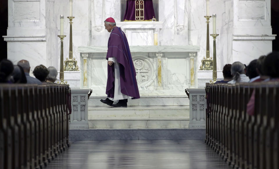 Bishop Ronald Gainer, of the Harrisburg Diocese, walks past the altar as he celebrates mass at the Cathedral Church of Saint Patrick in Harrisburg, Pa., Friday, Aug. 17, 2018. The grand jury report released this week found rampant sexual abuse of more than 1,000 children by about 300 priests in six Pennsylvania dioceses over seven decades. It criticized Gainer for advocating to the Vatican that two abusive priests not be defrocked. (AP Photo/Matt Rourke)